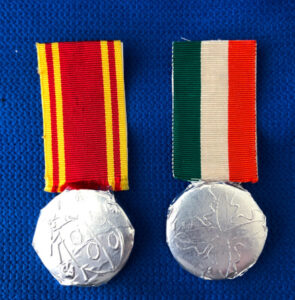 Two medal pin badges