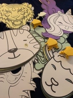 a selection of masks including tigers, sheep and dragons